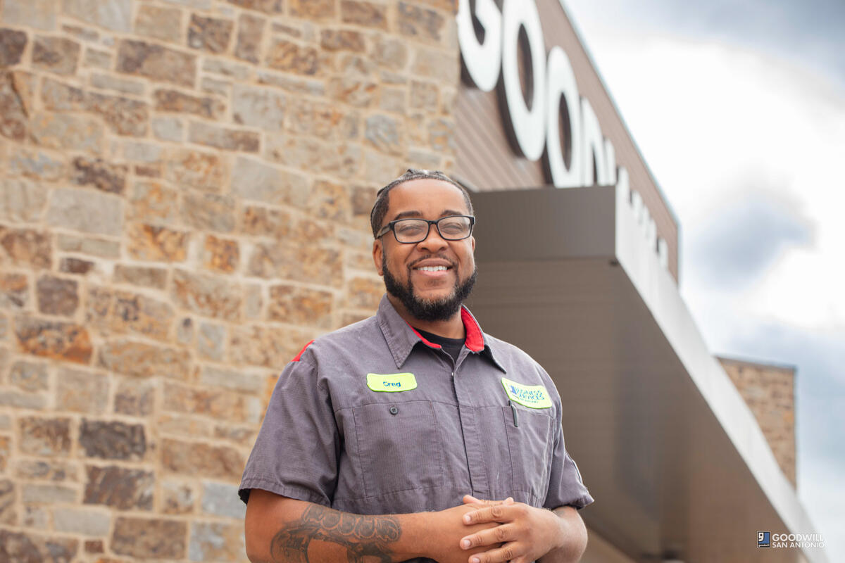 Goodwill San Antonio Business Services employee, male, glasses, grey shirt