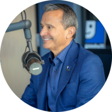 Carlos Contreras sitting in front of a microphone